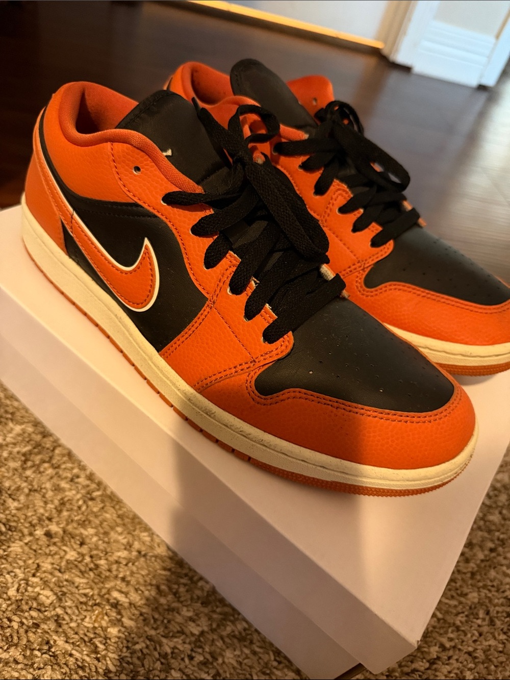 Jordan 1 Low-Top Sneakers in Orange and Black with White Accent